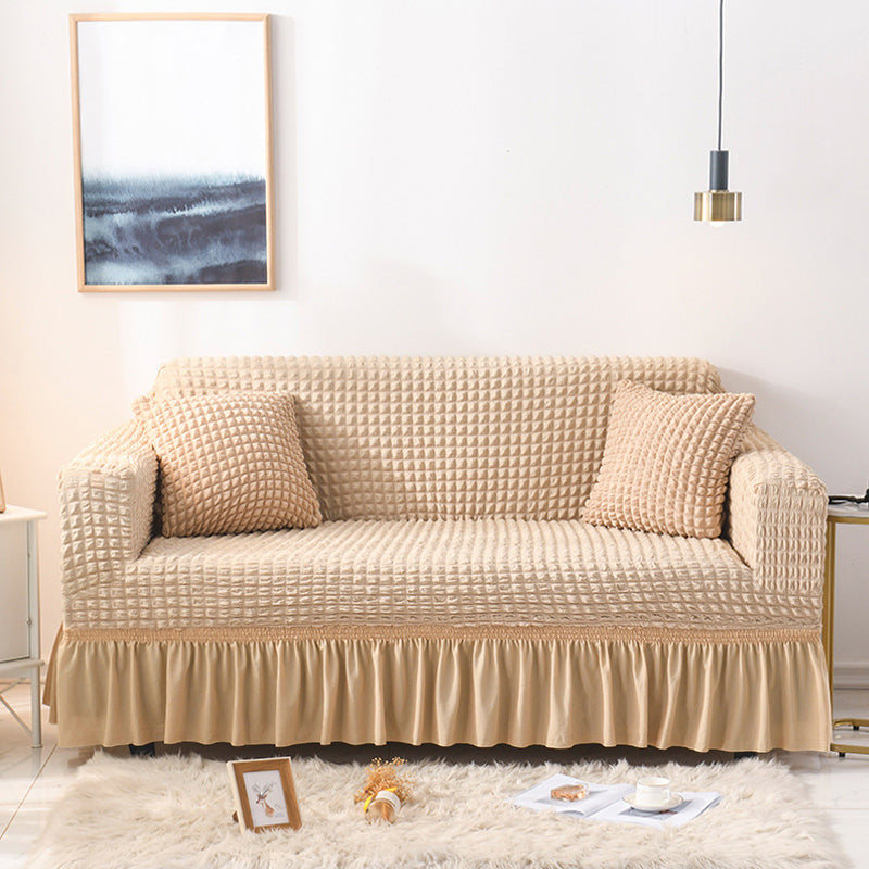 Sofaüberzug mit elastischen Rüschen und Noppenstruktur