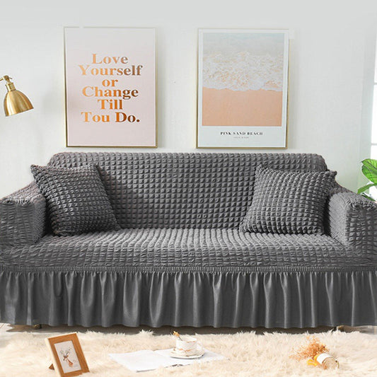Sofaüberzug mit elastischen Rüschen und Noppenstruktur