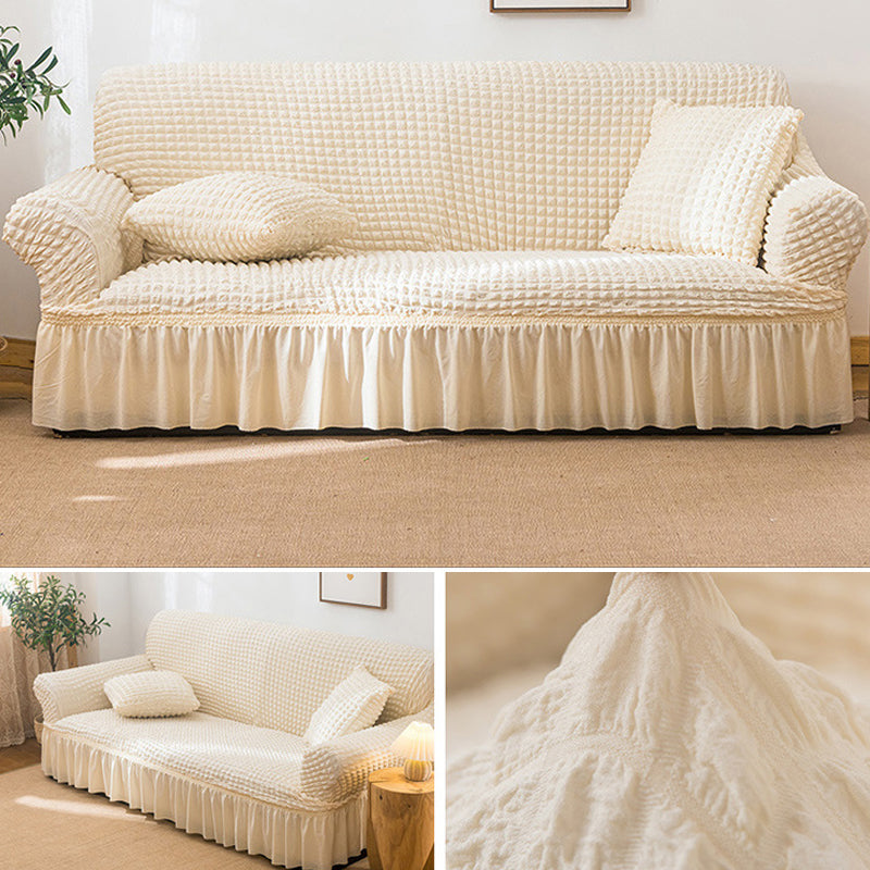 Sofaüberzug mit elastischen Rüschen und Noppenstruktur