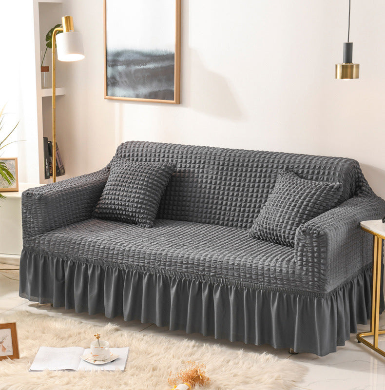 Sofaüberzug mit elastischen Rüschen und Noppenstruktur