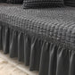 Sofaüberzug mit elastischen Rüschen und Noppenstruktur