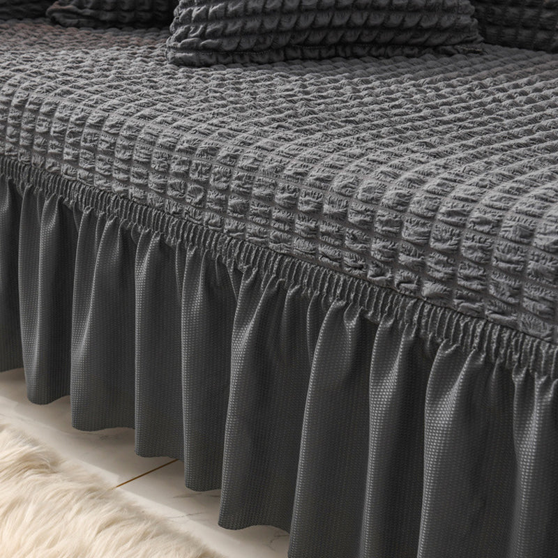 Sofaüberzug mit elastischen Rüschen und Noppenstruktur