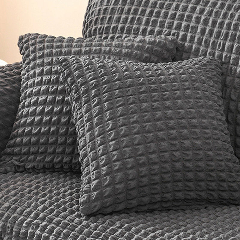 Sofaüberzug mit elastischen Rüschen und Noppenstruktur