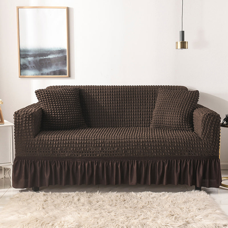 Sofaüberzug mit elastischen Rüschen und Noppenstruktur